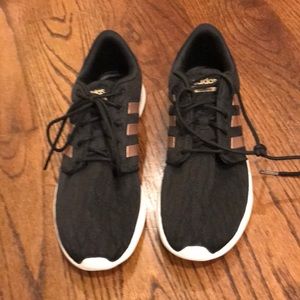 Black lace Adidas sneakers